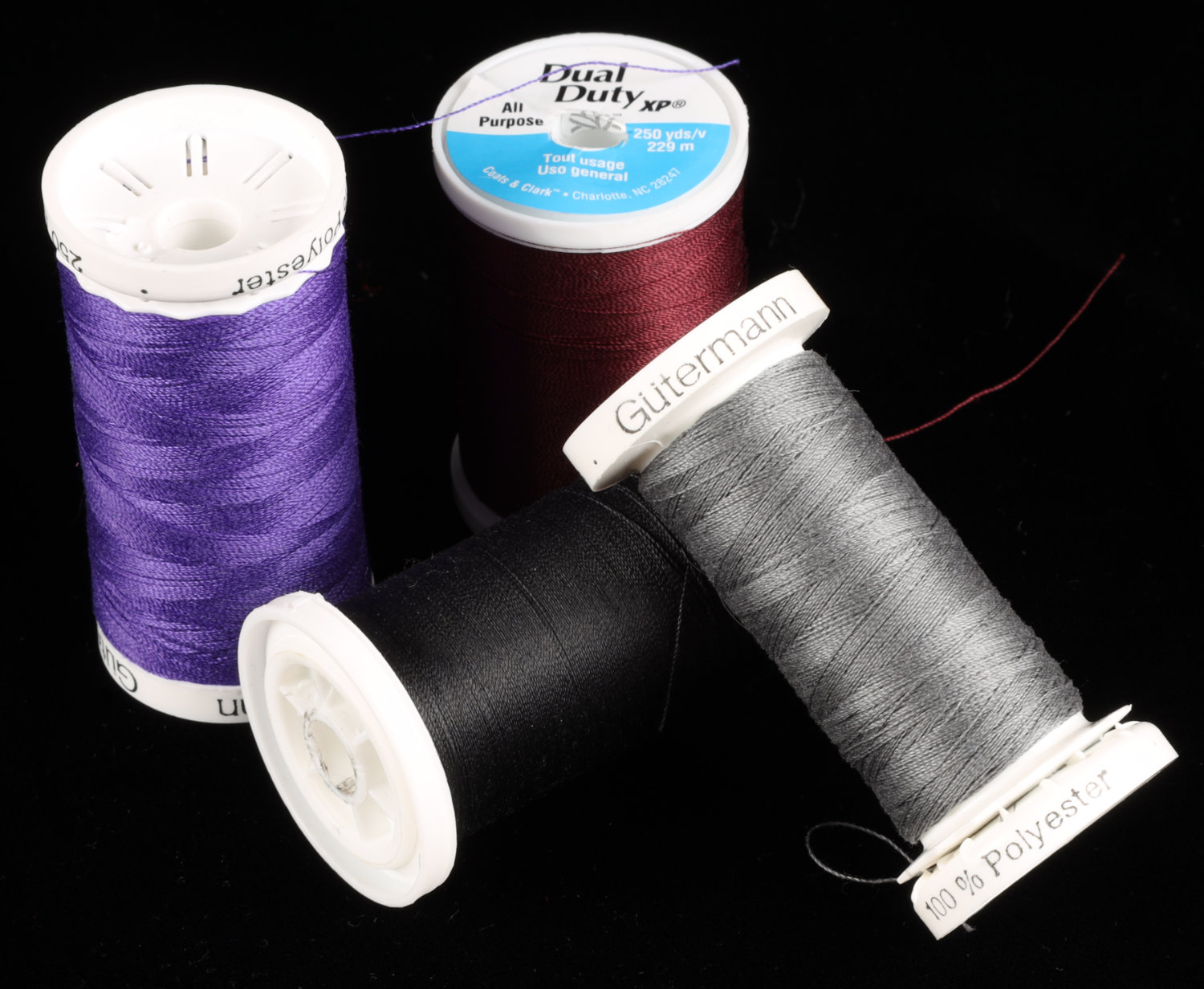 A variety of spools of all-purpose sewing thread types